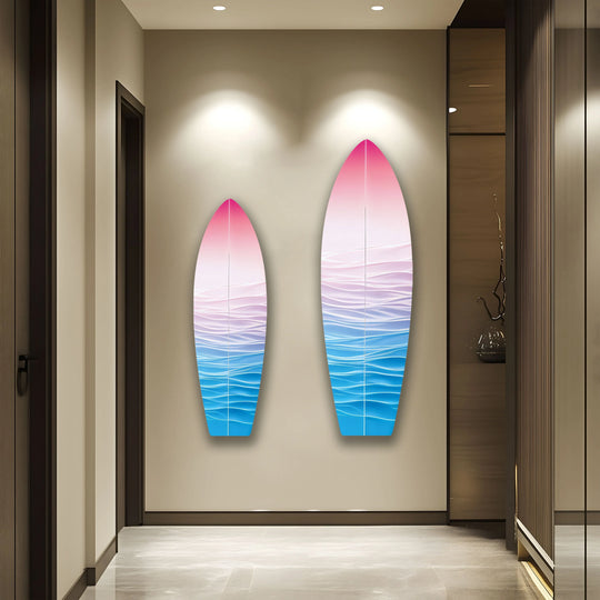Two tranquil pink and blue gradient surfboard glass wall art pieces evoke a sense of serene stillness.