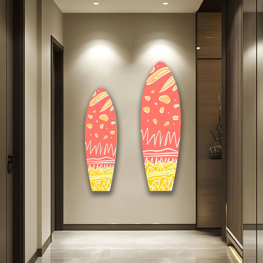Pink abstract surfboard art with a glossy tempered glass wall art finish hangs on a wall.
