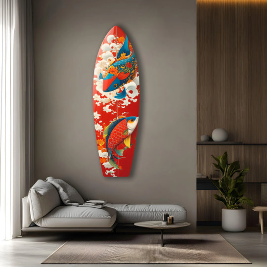 A vertically oriented surfboard shape adorned with colorful koi fish serves as unique modern wall decor.