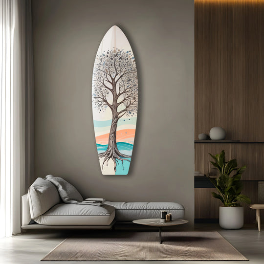 A surfboard-shaped glass print wall art with a brown tree design featuring a distinct edge and border detail.