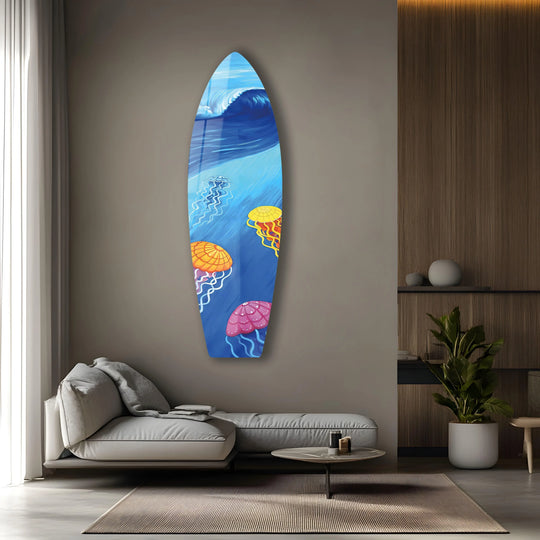 Glossy glass art painting featuring vibrant jellyfish and a dynamic ocean wave on a surfboard's textured surface.