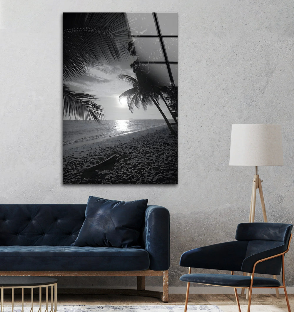 Peaceful black and white beach scene on glass with sunlit waves and overhanging palms.
