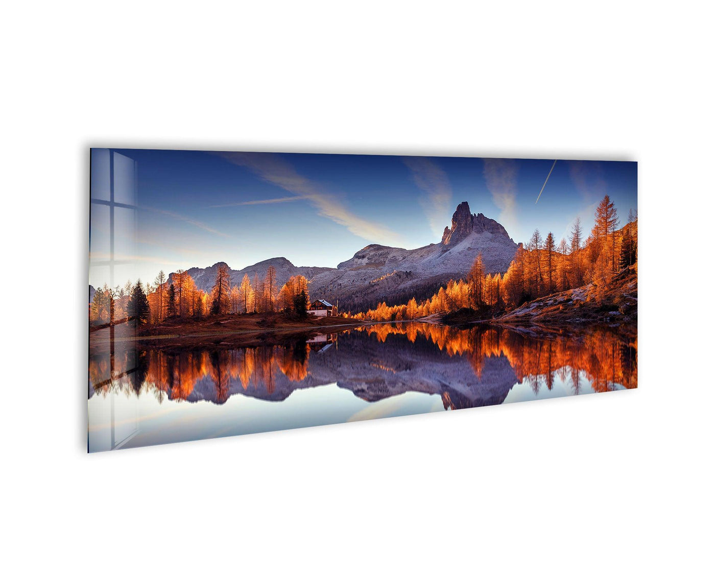 Geometric mountain lake landscape glass wall art features symmetrical reflections creating triangular shapes against a blue sky, complementing modern home decor.