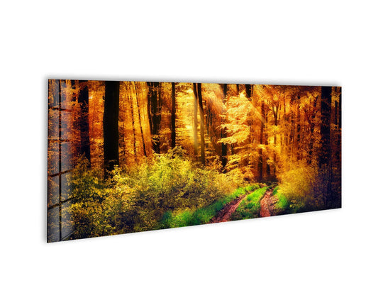 Sunlight streaming through the trees is the softest element in this autumnal landscape glass art painting, illuminating the forest path.