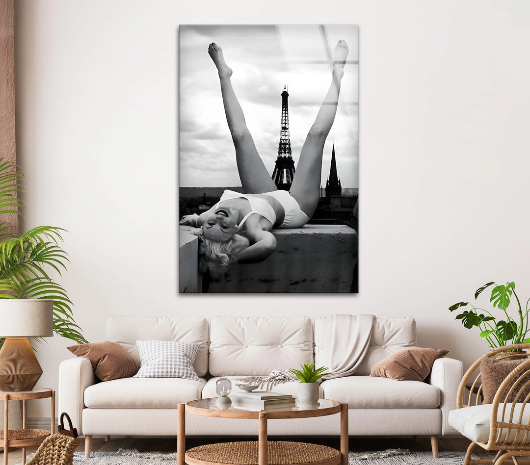 Artistic monochrome Paris scene with a woman posing freely above city buildings.