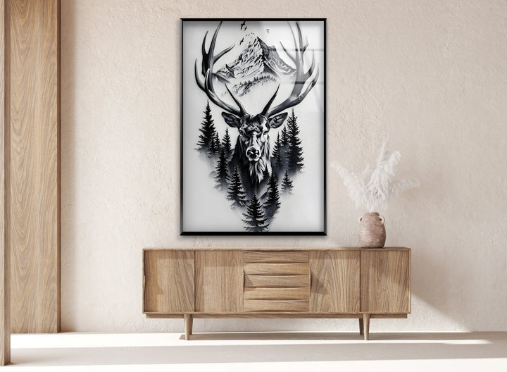 Monochrome wildlife glass art featuring a stag blending into pine trees and rugged peaks.