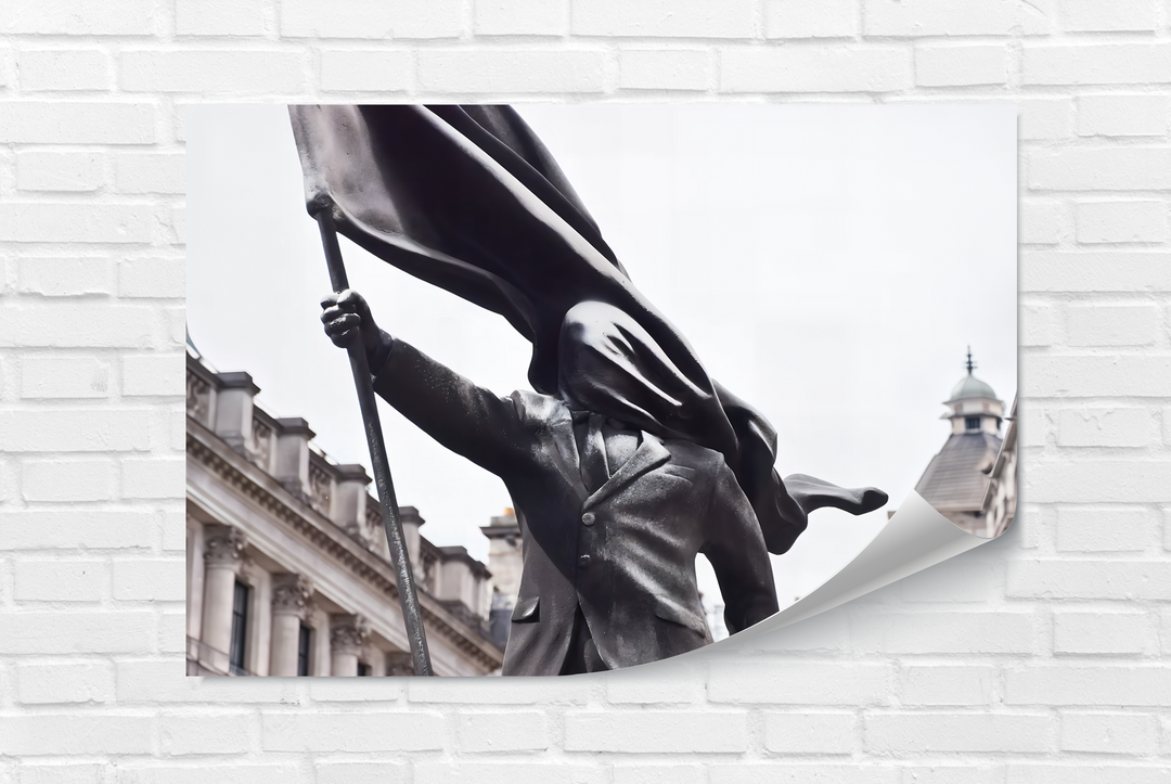Realistic detail showcases the rough texture of the Banksy Flag Bearer statue and flowing flag in this striking glass wall art decor.