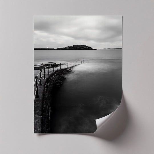 Curled edge reveals the pristine border of these high quality canvas prints, depicting a monochrome coastal scene of an island passage.