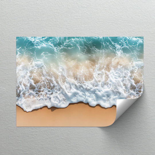 The realistic detail shows the surf and foam in this premium canvas decor, capturing a perfect overhead shot of ocean waves meeting a sandy beach.