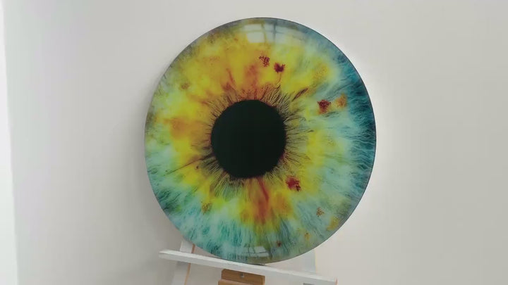 Runde Glaswandkunst mit farbigem Auge