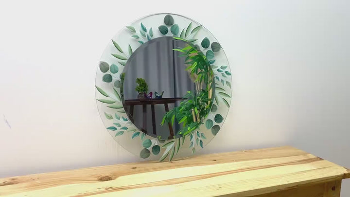 Transparenter runder Wandspiegel mit grünen Blättern