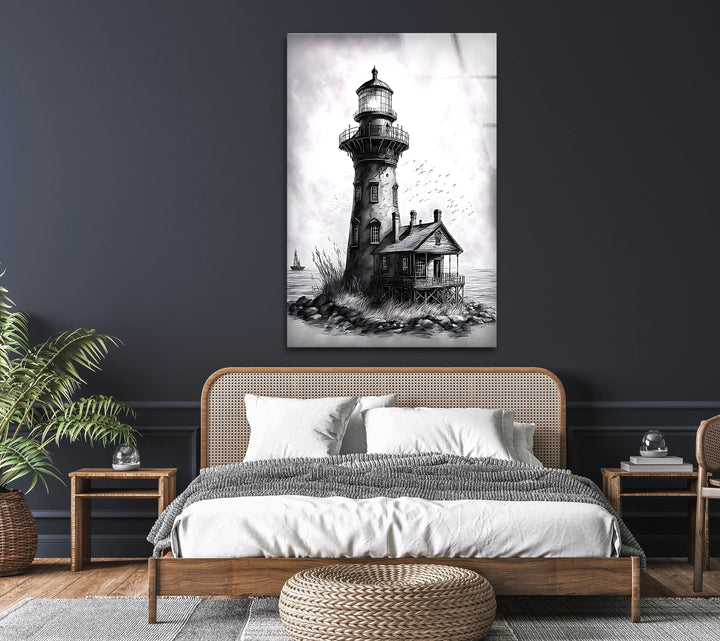 Monochrome glass art featuring an old lighthouse beside a rustic coastal house.