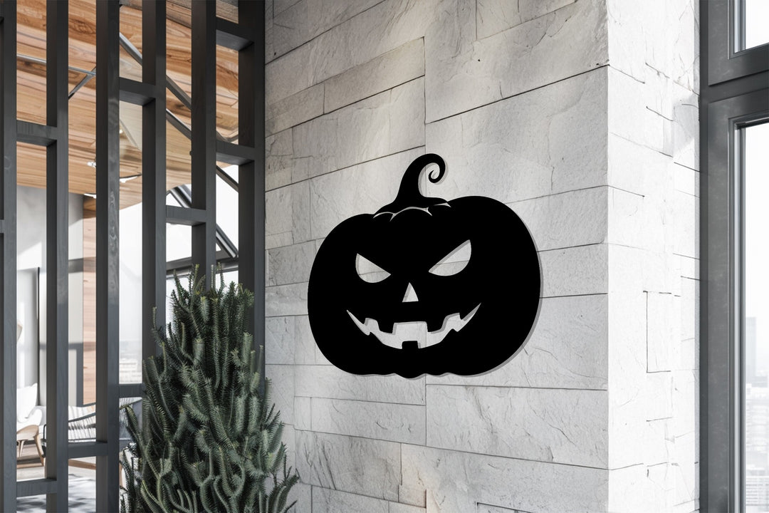 Halloween-themed jack-o’-lantern metal wall décor piece