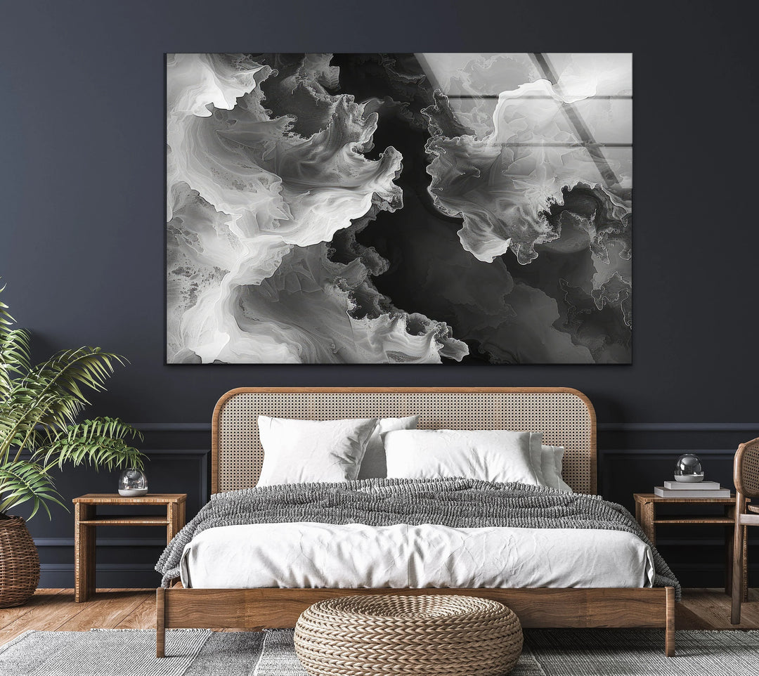 Artistic black and white glass panel showcasing fluid swirling forms for modern minimalist decor.