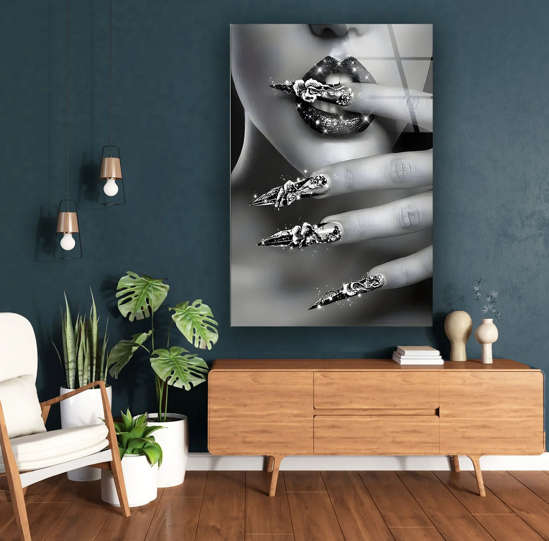 Artistic black and white beauty close-up showcasing luminous lips and sculpted sparkling nails.