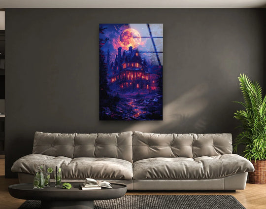 A tall, vertical glass printing of a spooky haunted house dominates the dark, moonlit landscape.