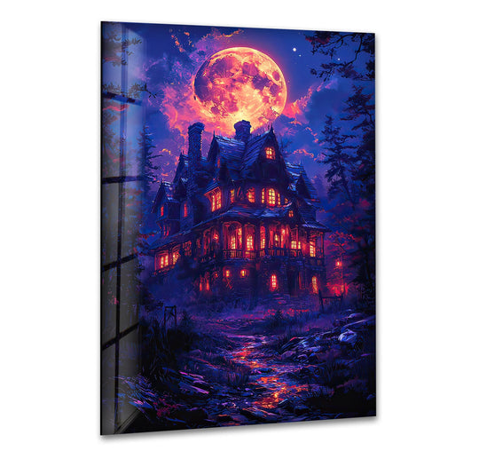 The luminous, fiery full moon dominates this spooky haunted house tempered glass wall art, casting an orange glow.