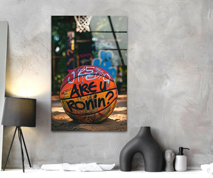 Urban basketball scene on glass showing a colorful graffiti-marked ball beneath a hoop.