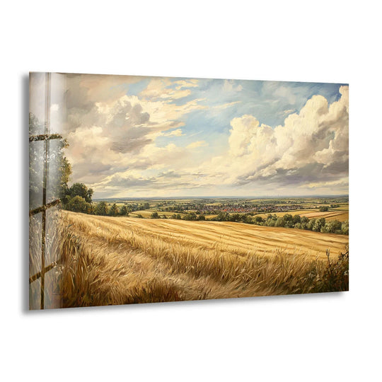 Bright cumulus clouds illuminate a golden wheat field in this panoramic landscape print wall art, creating a luminous horizon of rural charm on glass.