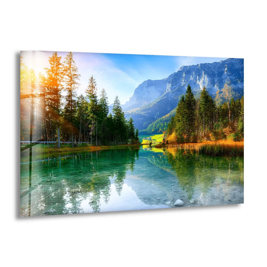 Visual rhythm is created in this glass print wall art by the alternating dark and light reflections on the alpine lake beneath the mountain view.