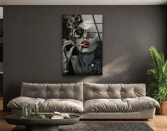 A striking woman in sunglasses enjoys a moment of stillness with art from glass.