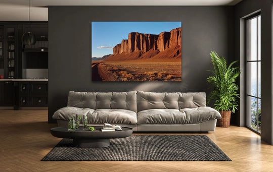 In the background, the stark grey wall beautifully showcases the vibrant 'Utah Mountains' landscape art on tempered glass wall art.