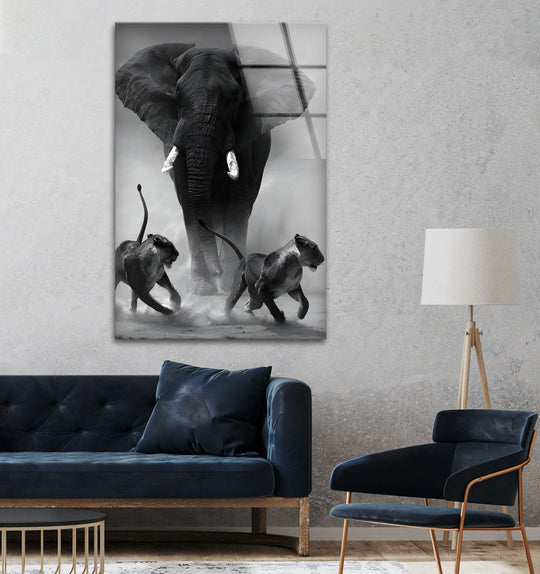 Wild Power glass wall art shows a black and white elephant and lions and is wildlife artwork and modern animal wall decor bringing bold decor