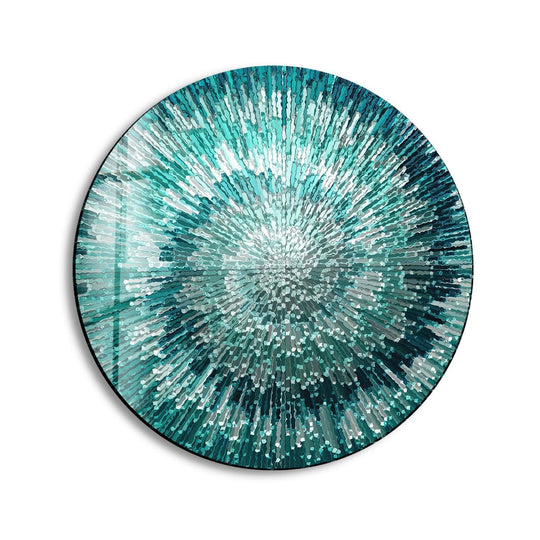 A round glass printing artwork with a radiant, exploding abstract pattern in silver and teal hues.