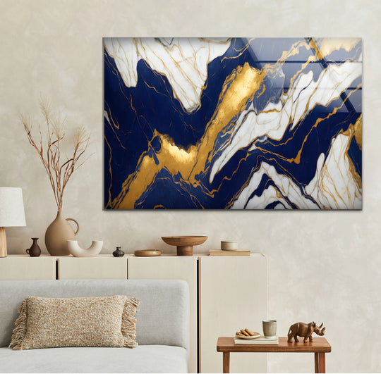 Shadows deepen the navy blue swirls, highlighting the golden veins against the bright white marble in this striking glass art.