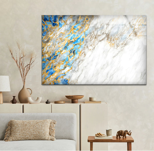 Ethereal organic forms of blue, gold, and white marble swirl across this stunning glass wall art print.