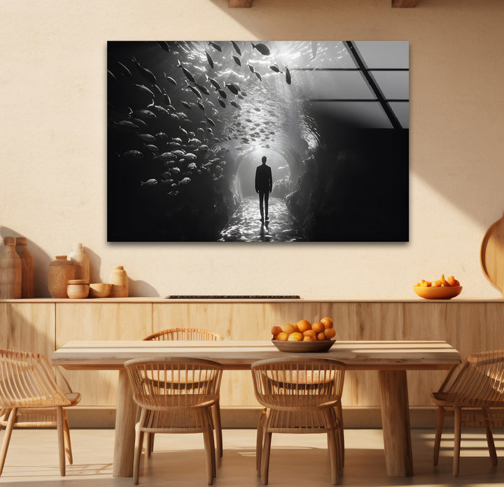 Refined black and white framed art showcasing the elegance of a man walking among fish.