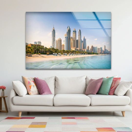Towering skyscrapers highlight the focal point in this Dubai skyline best glass art print, capturing a beachfront cityscape view with tranquil turquoise waters.