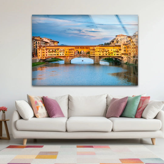 The Ponte Vecchio bridge is the focal point of this Florence glass wall art, an ideal home decoration featuring the Arno River.