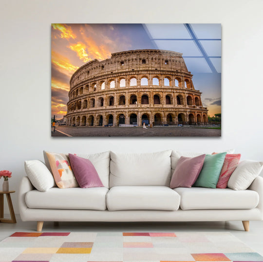 Illuminated by a sunset glow, the grandiose Colosseum is captured in this glass wall art, acting as the loudest element in stylish home decor.