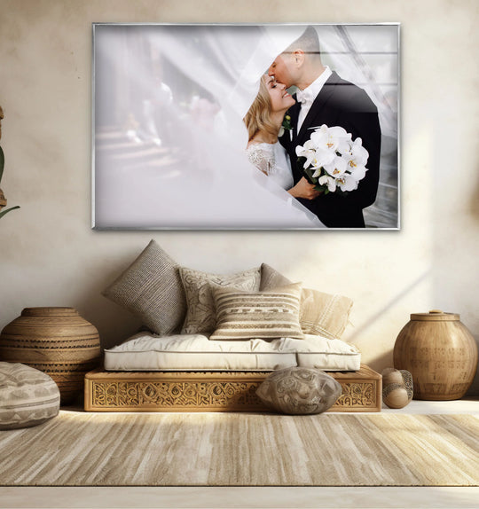 Subtle layering effect is achieved with the bride's veil over the couple in the framed custom glass wall artwork, adding depth and emotion to the personalized wall decor.