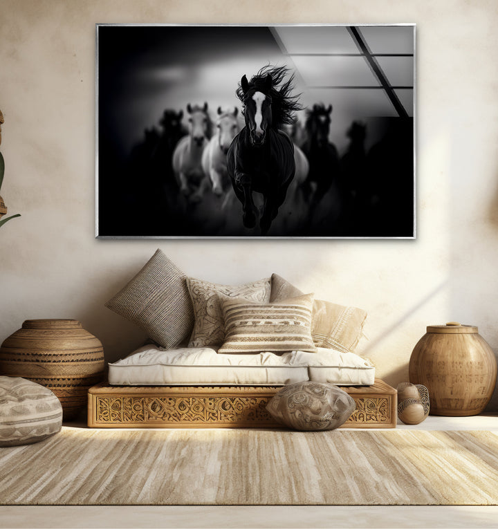 Bold black and white framed art of galloping horses, combining realism with artistic elegance.