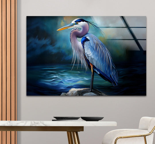 Dominating navy and deep blues define this realistic glass wall art decor of a solitary heron against a moody ocean backdrop.
