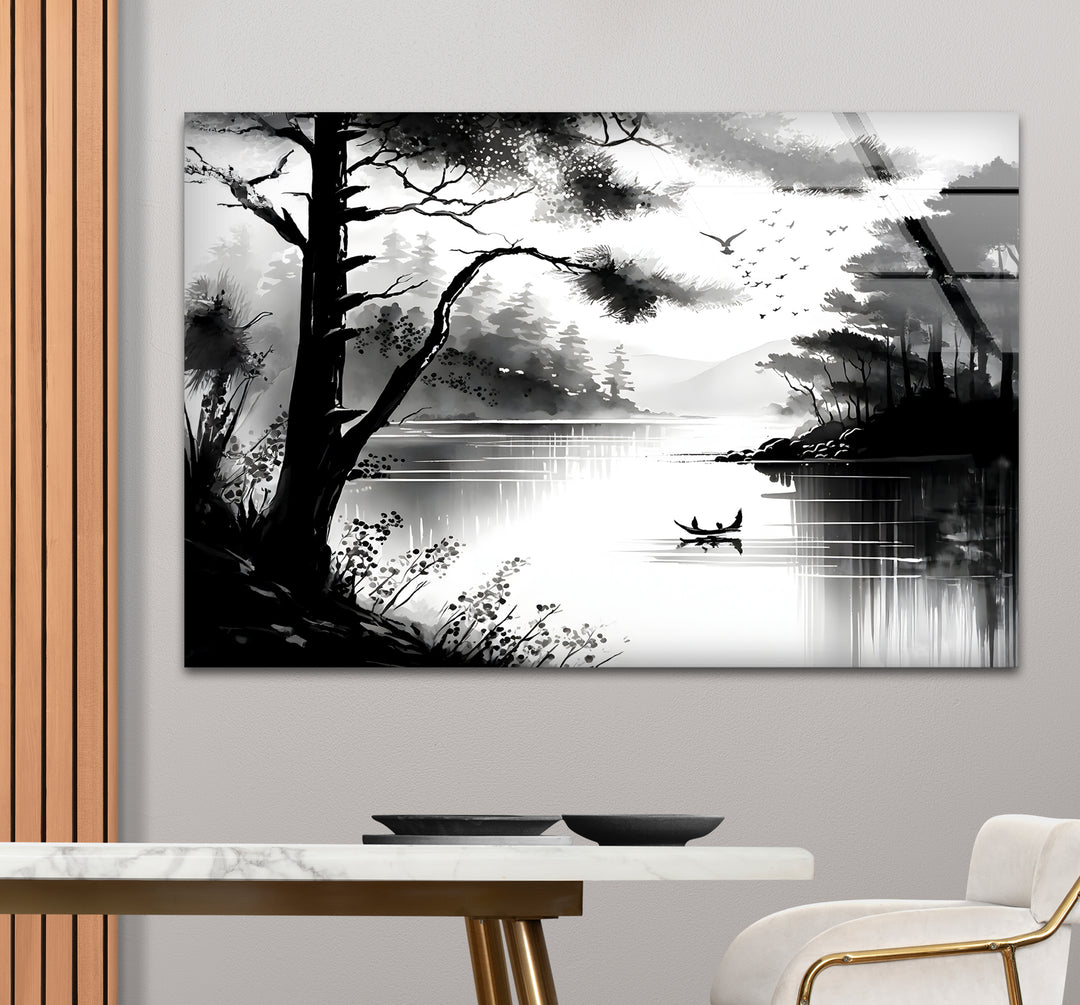 Stylish black and white framed art capturing the reflection of trees in a calm lake.