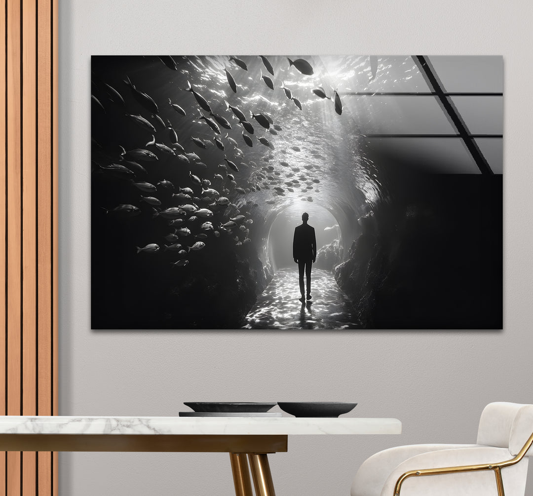 Sophisticated black and white framed art of a man in an aquarium with dramatic lighting.