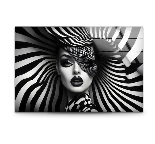 A striking black and white glass wall artwork captures a woman's face with dramatic makeup and a zebra-striped headdress.