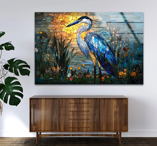 Mosaic heron decorative wall art with a sunlit, watery background in shades of orange and blue.