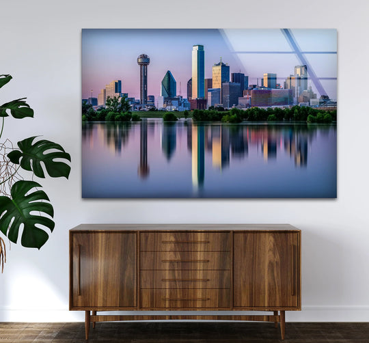 Showcasing the realistic detail, a Dallas skyline reflects beautifully on the water in this high-resolution glass wall art decor, capturing the essence of the city's cityscape.