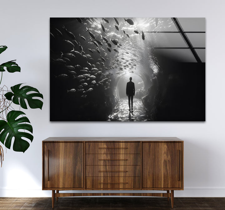 Modern black and white wall decor with a stunning scene of a man surrounded by fish.