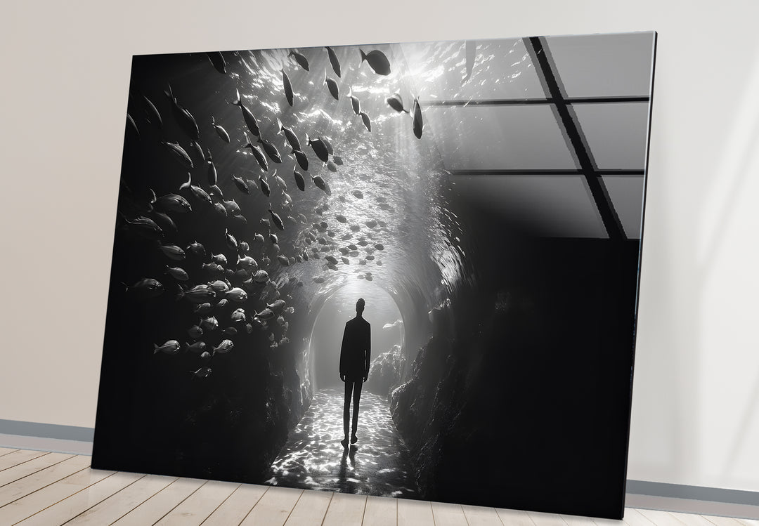 Bold black and white abstract art featuring the surreal imagery of an aquarium and a lone figure.
