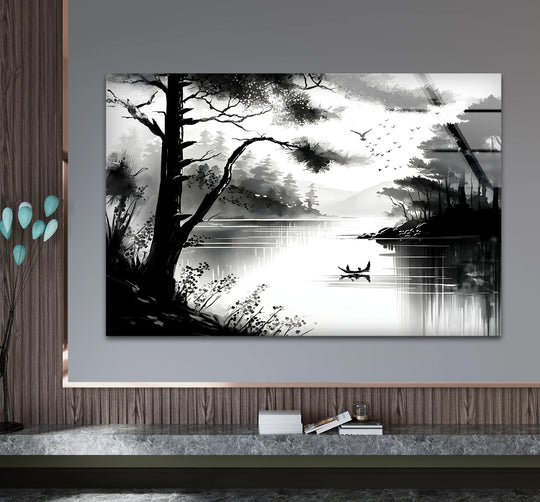 Against a gray wall, the black and white lake view glass wall art features distant mountains and cloudy skies, showcasing the beauty of decorative wall art.