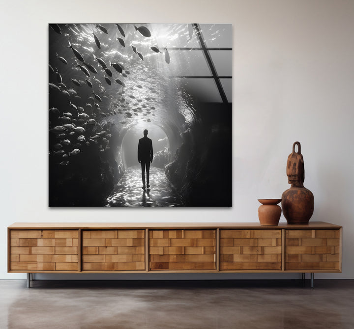 Stunning black and white paintings of a man walking through an aquarium, perfect for modern interiors.