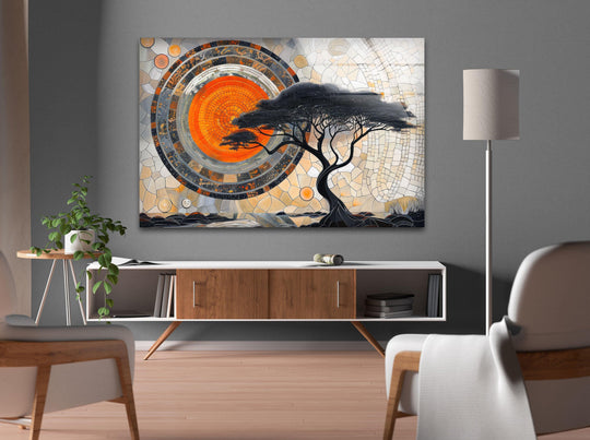 Mosaic design glass wall art features a warm orange sun transitioning into earthy tones and a dark silhouetted tree, creating a stunning focal point for home decor.