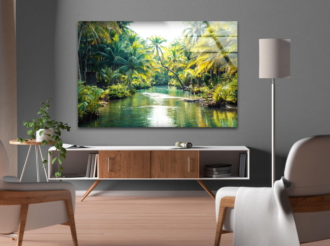 Tropical river landscape with lush greenery and golden sunlight reflections.
