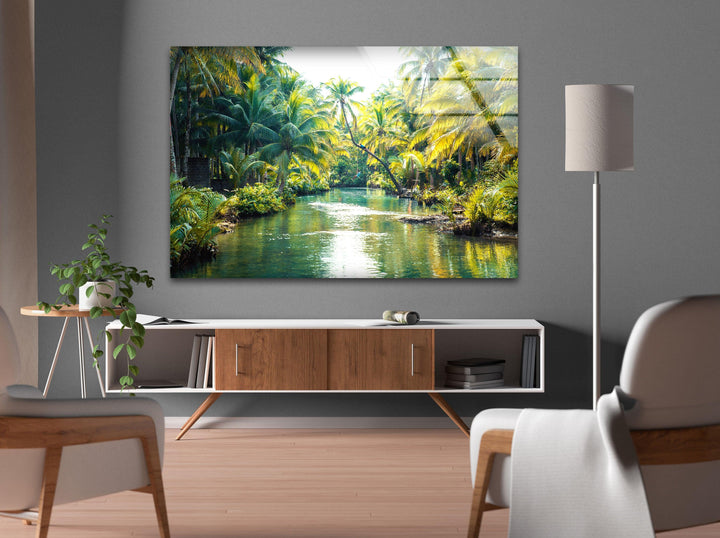 Tropical river landscape with lush greenery and golden sunlight reflections.
