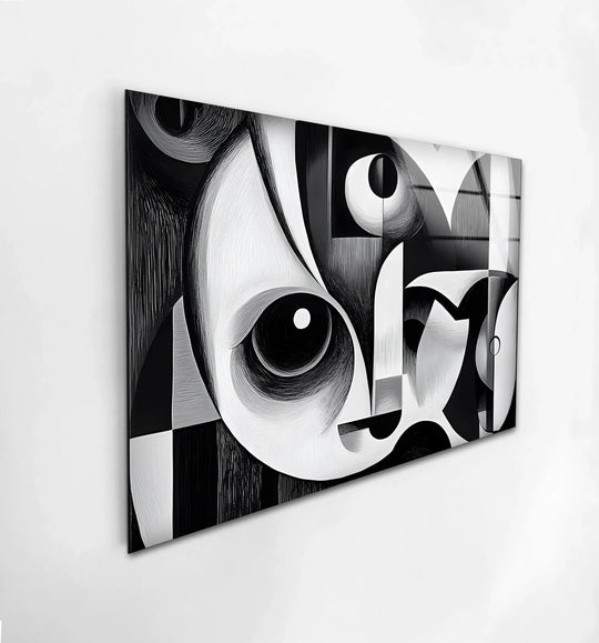 A monochrome cubist glass art piece captures a striking stillness in its abstract forms, adding quiet drama to home decor.